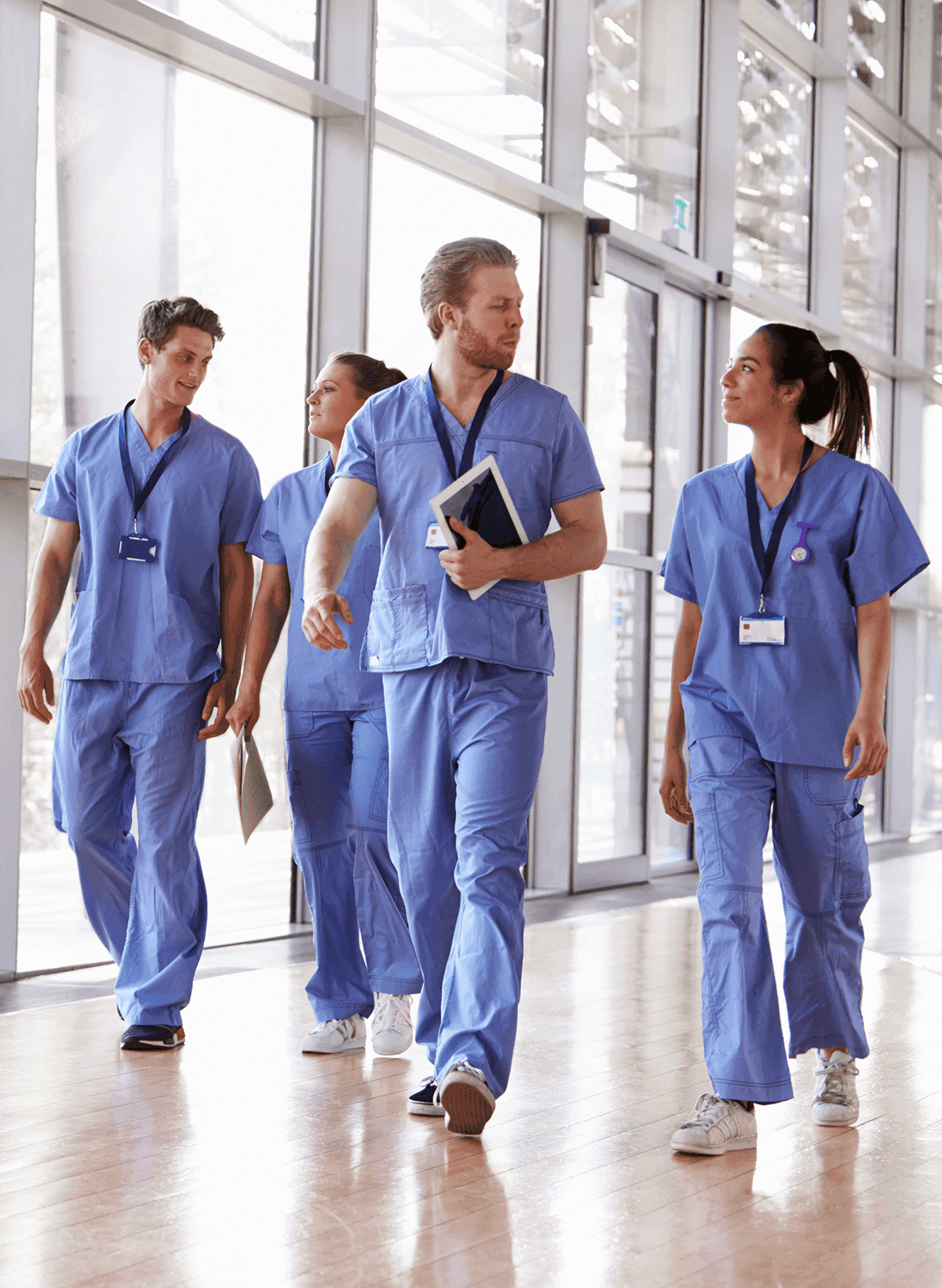 A surgical team walking down a hospital corridor